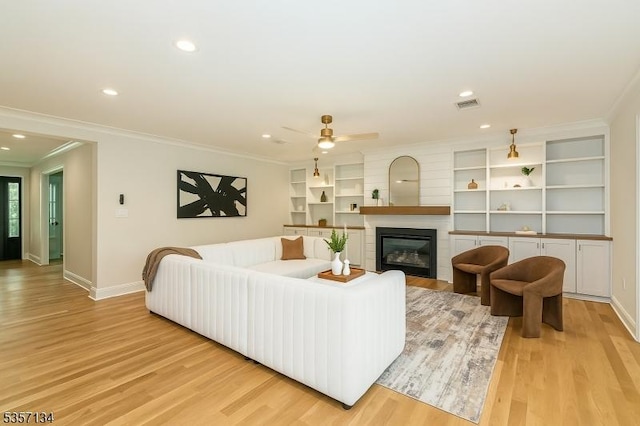 157 Meyersville Rd, Chatham Twp, NJ 07928 - living area featuring light wood-style floors, baseboards, crown molding, a glass covered fireplace, and ceiling fan