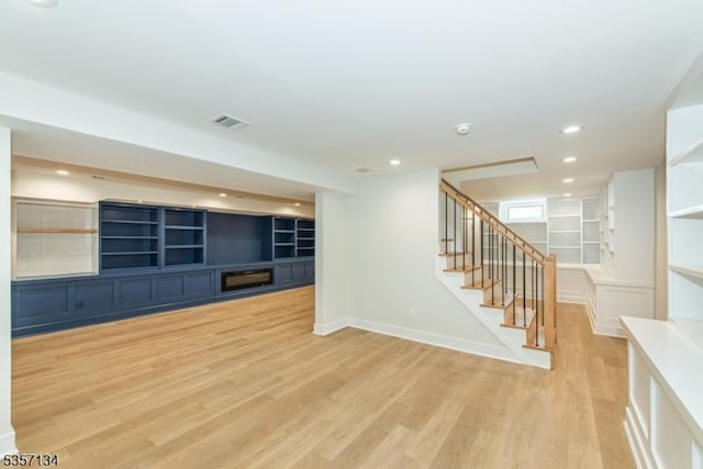 157 Meyersville Rd, Chatham Twp, NJ 07928 - unfurnished living room featuring wood finished floors, built in features, stairs, baseboards, and recessed lighting
