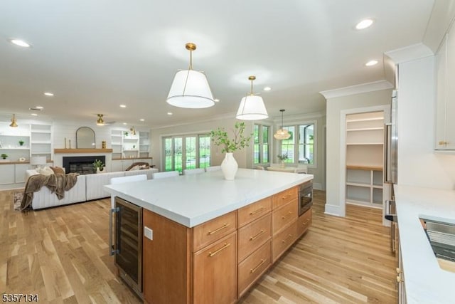 157 Meyersville Rd, Chatham Twp, NJ 07928 - kitchen featuring beverage cooler, light wood-type flooring, crown molding, recessed lighting, and a kitchen island