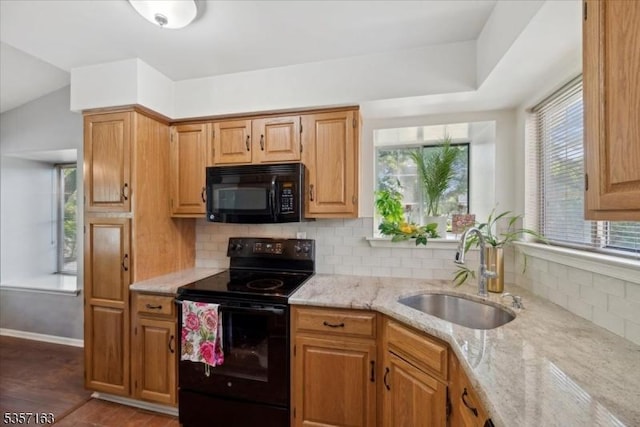 48 Spruce Ct, Bedminster Twp, NJ 07921 - kitchen with black appliances, a sink, light stone counters, tasteful backsplash, and wood finished floors