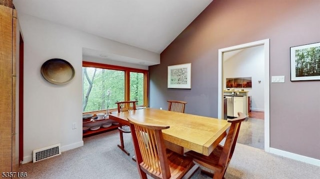 15 Pschorn Ln, Hillsborough Twp, NJ 08844 - carpeted dining space with high vaulted ceiling and baseboards