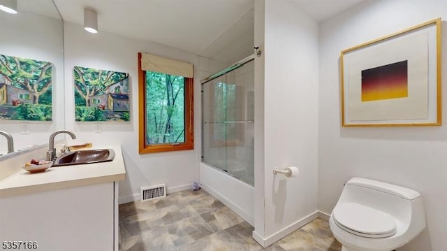 15 Pschorn Ln, Hillsborough Twp, NJ 08844 - bathroom with toilet, vanity, bath / shower combo with glass door, and baseboards