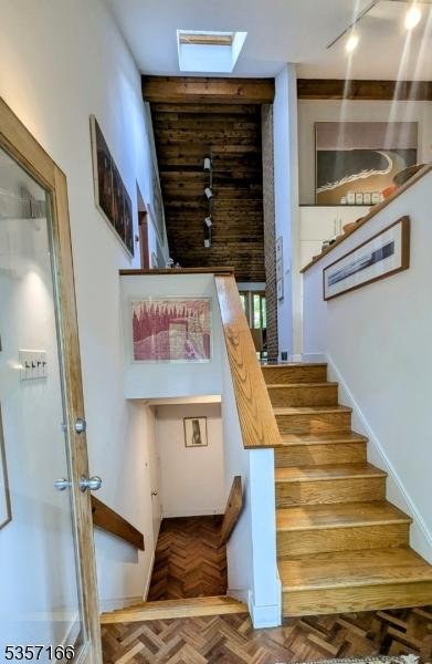 15 Pschorn Ln, Hillsborough Twp, NJ 08844 - stairs with track lighting and a skylight
