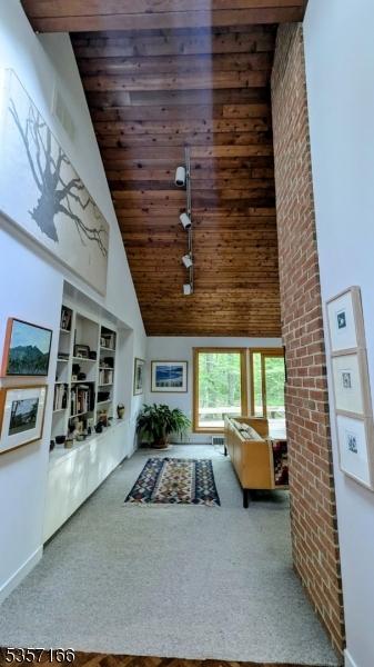 15 Pschorn Ln, Hillsborough Twp, NJ 08844 - hallway featuring high vaulted ceiling, wood ceiling, carpet, and baseboards