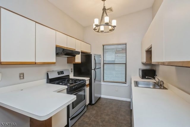 kitchen featuring appliances with stainless steel finishes, under cabinet range hood, white cabinetry, a sink, and light countertops
