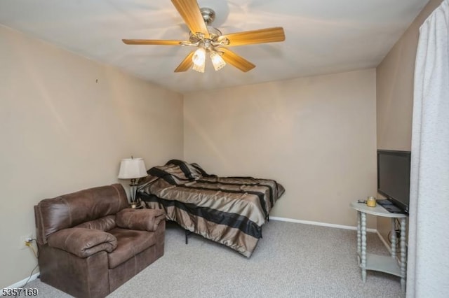carpeted bedroom featuring a ceiling fan and baseboards