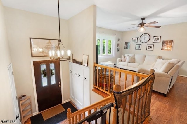 642 Succasunna Rd, Mount Arlington Boro, NJ 07850 - entryway with dark wood finished floors, a chandelier, and ceiling fan