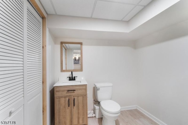 642 Succasunna Rd, Mount Arlington Boro, NJ 07850 - half bathroom featuring toilet, wood finished floors, vanity, a closet, and baseboards