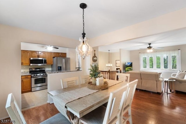 642 Succasunna Rd, Mount Arlington Boro, NJ 07850 - dining space featuring ceiling fan, light wood-style floors, and a chandelier