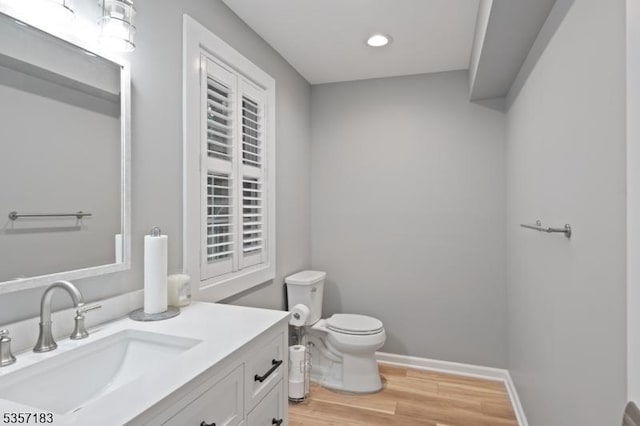 276 River Dr, River Vale Twp, NJ 07675 - half bath with wood finished floors, vanity, toilet, recessed lighting, and baseboards