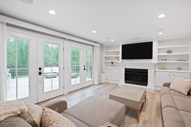 276 River Dr, River Vale Twp, NJ 07675 - living room featuring french doors, light wood-type flooring, recessed lighting, and a fireplace