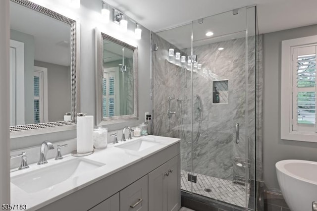 276 River Dr, River Vale Twp, NJ 07675 - bathroom with a marble finish shower, a freestanding tub, and double vanity