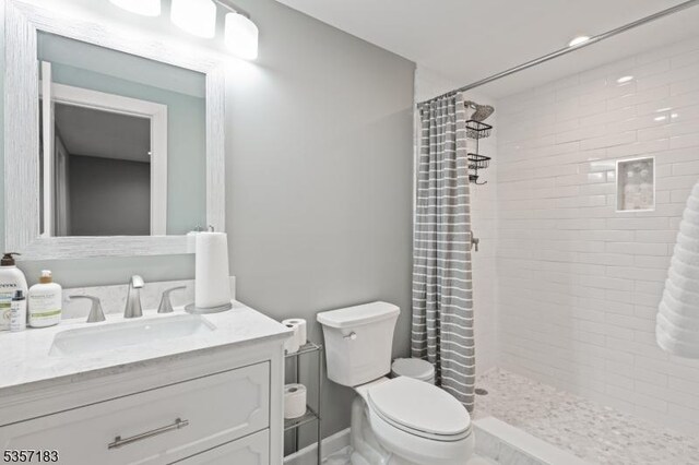 276 River Dr, River Vale Twp, NJ 07675 - bathroom with toilet, a tile shower, and vanity