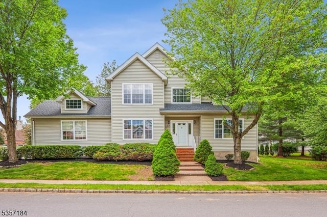 47 Nostrand Rd, Hillsborough Twp, NJ 08844 - traditional-style home featuring a front yard and roof with shingles