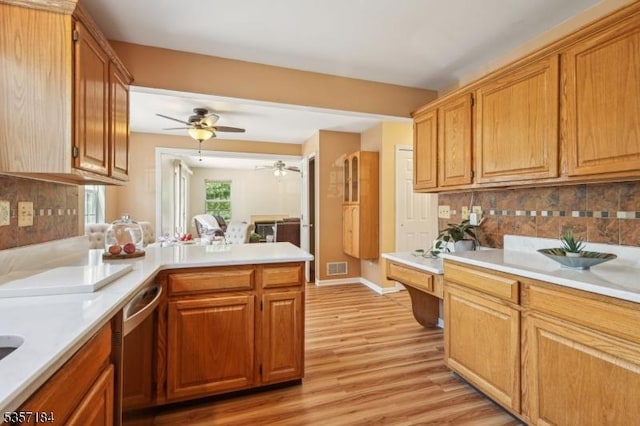 47 Nostrand Rd, Hillsborough Twp, NJ 08844 - kitchen with dishwasher, light countertops, a peninsula, and light wood-style flooring