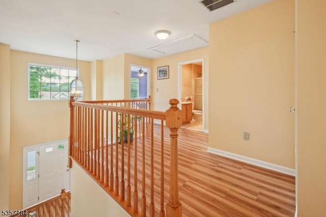 47 Nostrand Rd, Hillsborough Twp, NJ 08844 - corridor with an upstairs landing, attic access, baseboards, and light wood-style floors