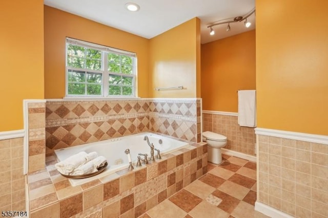 47 Nostrand Rd, Hillsborough Twp, NJ 08844 - full bath with tile walls, a wainscoted wall, a bath, toilet, and tile patterned flooring