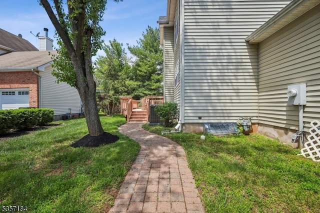 47 Nostrand Rd, Hillsborough Twp, NJ 08844 - view of green lawn featuring a wooden deck