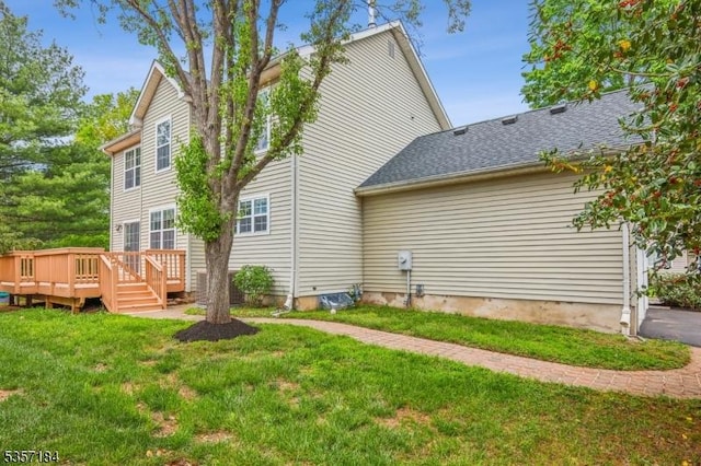 47 Nostrand Rd, Hillsborough Twp, NJ 08844 - back of property with a yard, a deck, and roof with shingles