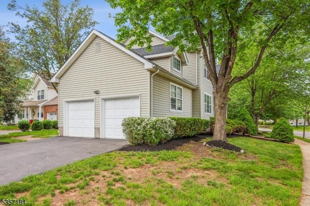 47 Nostrand Rd, Hillsborough Twp, NJ 08844 - view of side of home featuring driveway and an attached garage