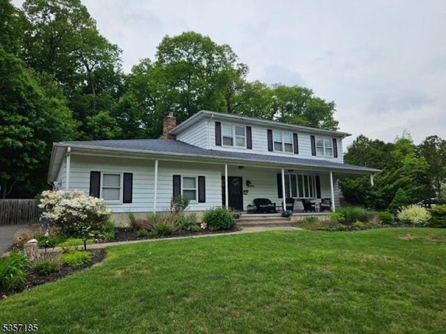 32 Northgate, Wanaque Boro, NJ 07465 - view of front of home with a porch and a chimney