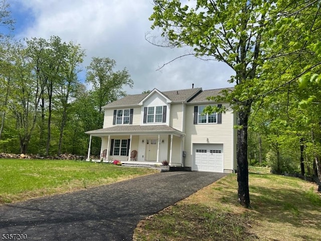56 Anthony Rd, Lebanon Twp, NJ 08826 - view of front of home featuring a porch, driveway, an attached garage, and a front lawn