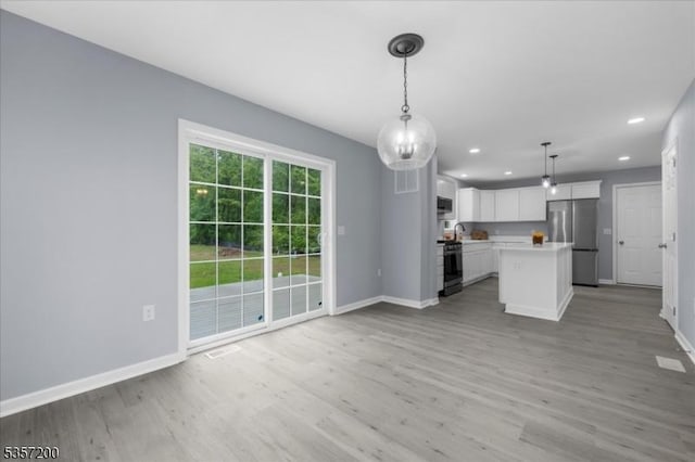 56 Anthony Rd, Lebanon Twp, NJ 08826 - kitchen featuring freestanding refrigerator, baseboards, gas stove, open floor plan, and recessed lighting