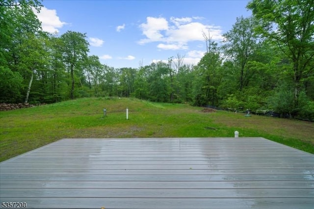 56 Anthony Rd, Lebanon Twp, NJ 08826 - deck featuring a wooded view and a yard