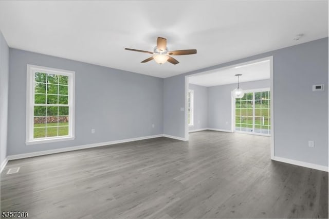 56 Anthony Rd, Lebanon Twp, NJ 08826 - empty room featuring baseboards, dark wood-type flooring, a ceiling fan, and a smoke detector