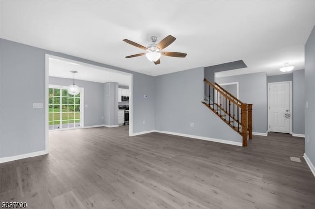 56 Anthony Rd, Lebanon Twp, NJ 08826 - unfurnished living room with stairs, ceiling fan, baseboards, and wood finished floors