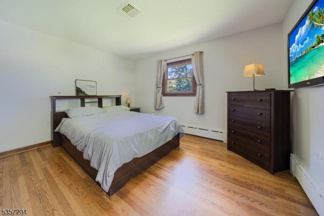 125 Flanders-Drakestown Rd, Mount Olive Twp, NJ 07836 - bedroom featuring a baseboard radiator and light wood-type flooring