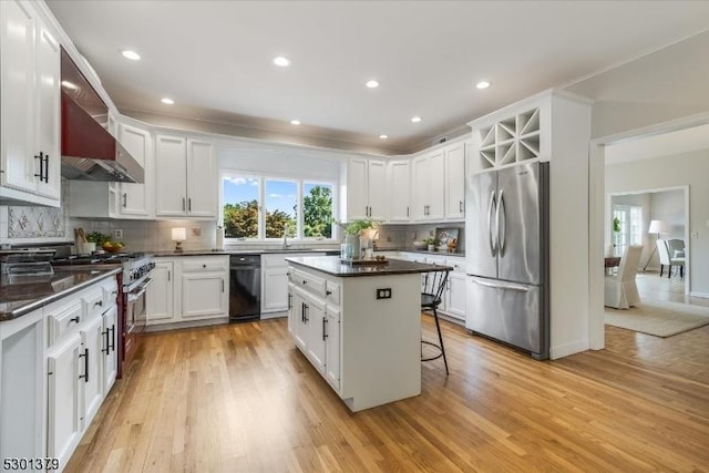 156 Fox Chase Rd, Chester Twp, NJ 07930 - kitchen featuring appliances with stainless steel finishes, plenty of natural light, wall chimney range hood, light wood-type flooring, and recessed lighting