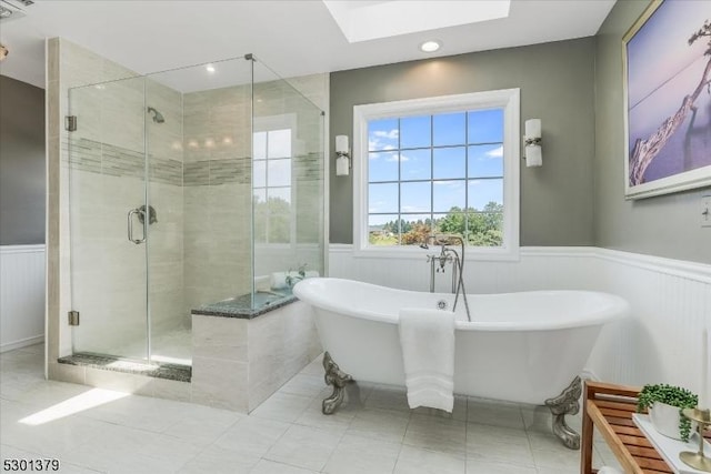 156 Fox Chase Rd, Chester Twp, NJ 07930 - bathroom with a wainscoted wall, a freestanding bath, a stall shower, a skylight, and tile patterned flooring