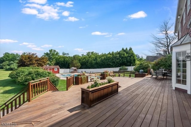 156 Fox Chase Rd, Chester Twp, NJ 07930 - deck with outdoor dining space, a shed, an outbuilding, an outdoor pool, and a fenced backyard