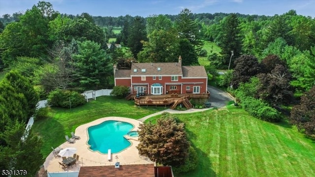 156 Fox Chase Rd, Chester Twp, NJ 07930 - back of property featuring a wooden deck, a forest view, an outdoor pool, and a patio area