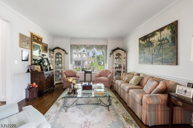 living room with wood finished floors and ornamental molding