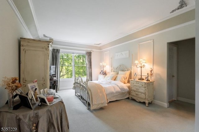 bedroom featuring light carpet, ornamental molding, and baseboards