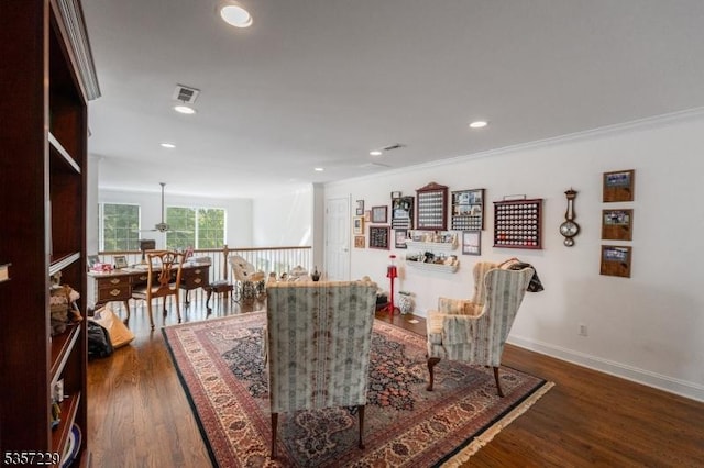 dining room with dark wood-style flooring, crown molding, baseboards, and recessed lighting