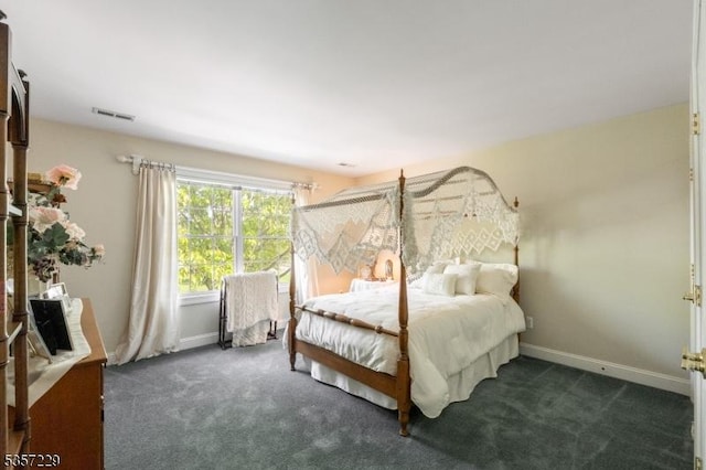 carpeted bedroom featuring baseboards