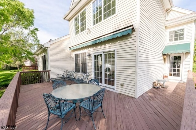 deck with outdoor dining space