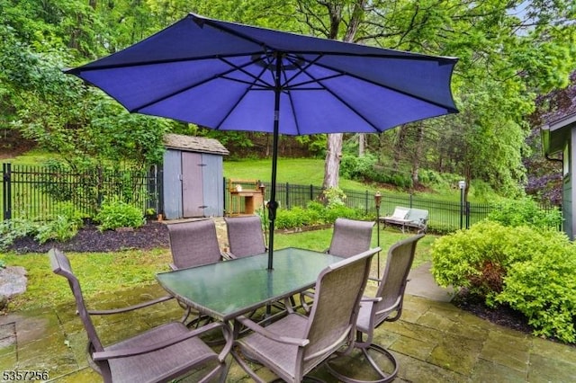 955 Stillwater Rd, Stillwater Twp, NJ 07860 - view of patio / terrace featuring a storage unit, outdoor dining space, and an outbuilding