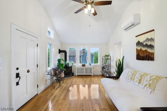 955 Stillwater Rd, Stillwater Twp, NJ 07860 - living area featuring radiator heating unit, a wall unit AC, a ceiling fan, high vaulted ceiling, and wood finished floors