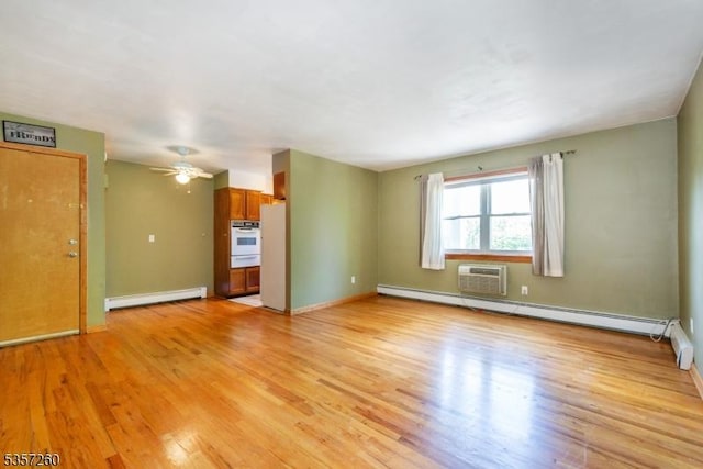 unfurnished living room featuring a baseboard radiator, light wood-type flooring, baseboard heating, baseboards, and ceiling fan