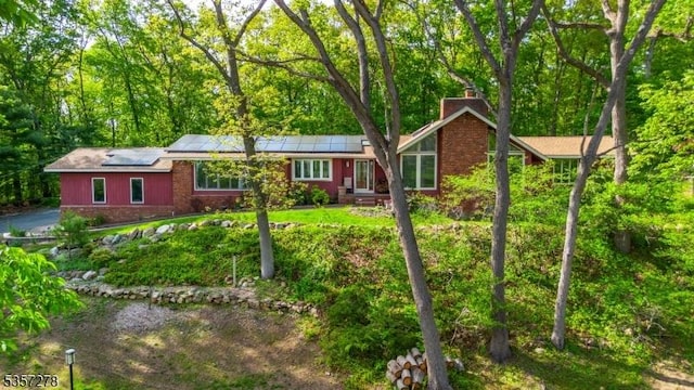 8 Reger Rd, Chester Twp, NJ 07836 - single story home featuring a chimney and roof mounted solar panels