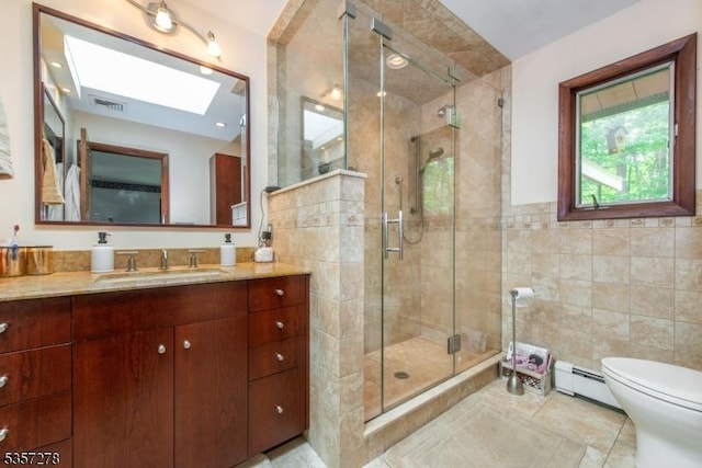 8 Reger Rd, Chester Twp, NJ 07836 - full bathroom featuring baseboard heating, tile walls, a shower stall, vanity, and toilet
