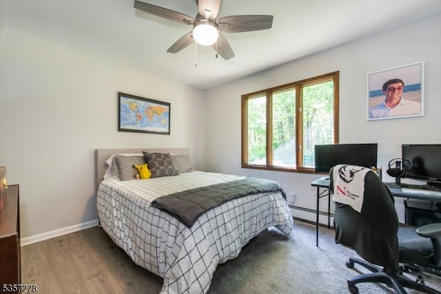 8 Reger Rd, Chester Twp, NJ 07836 - bedroom featuring baseboard heating, a desk, baseboards, wood finished floors, and a ceiling fan