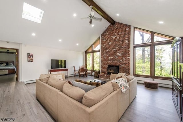 8 Reger Rd, Chester Twp, NJ 07836 - living room with a baseboard heating unit, high vaulted ceiling, beam ceiling, light wood-style floors, and a skylight