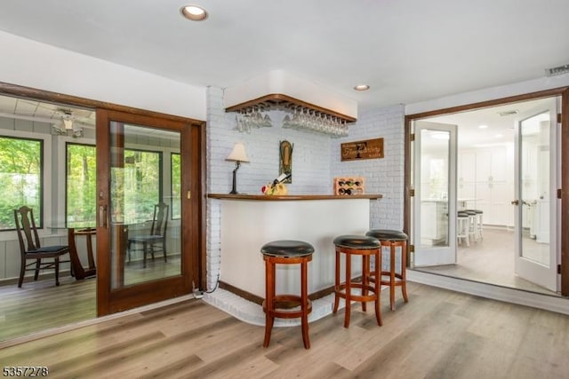 8 Reger Rd, Chester Twp, NJ 07836 - bar area with wood finished floors, recessed lighting, and brick wall