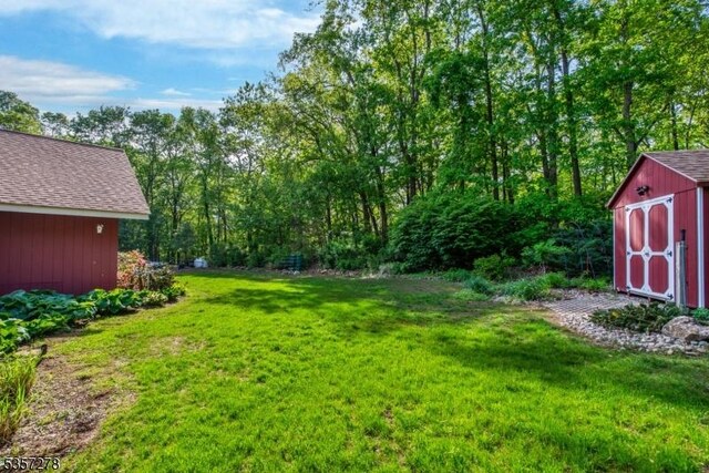 8 Reger Rd, Chester Twp, NJ 07836 - view of green lawn with a storage unit and an outbuilding