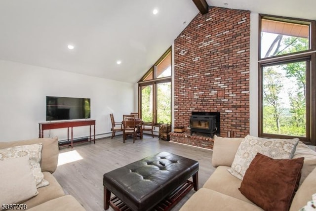 8 Reger Rd, Chester Twp, NJ 07836 - living area featuring high vaulted ceiling, a wood stove, beamed ceiling, wood finished floors, and recessed lighting